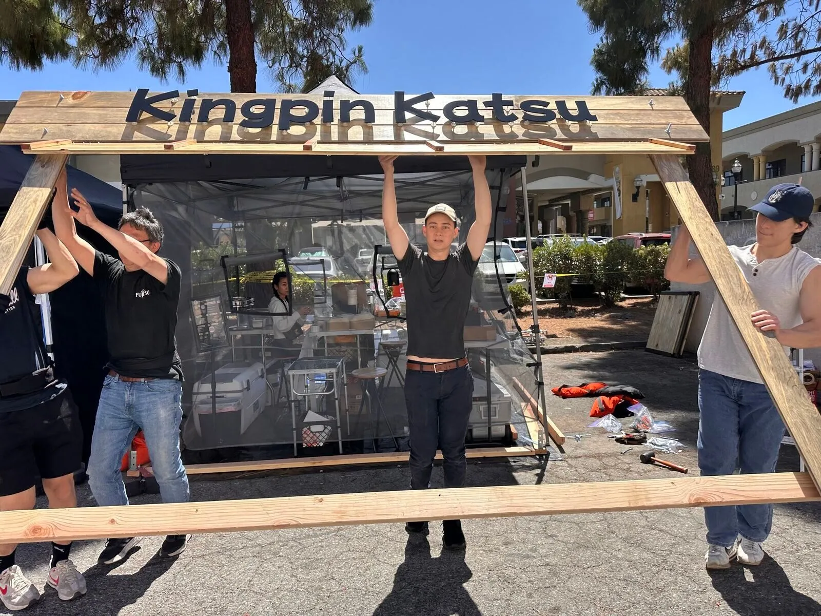 Building the wooden Kingpin Katsu booth