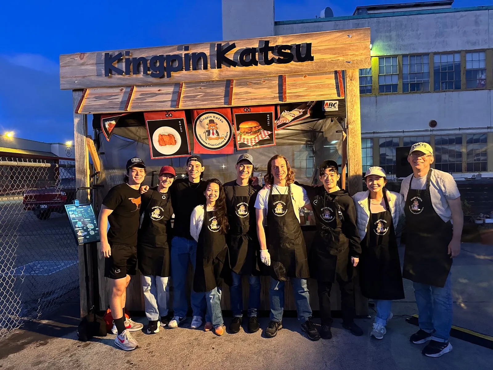 The Kingpin Katsu team in front of their booth at Faction Brewing